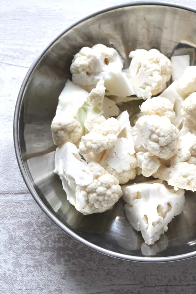 chopped cauliflower in a metal bowl