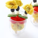 A fun way of serving tortellini.; on a stick with tomato, mozarella and basil. Great for kids and picky eaters!