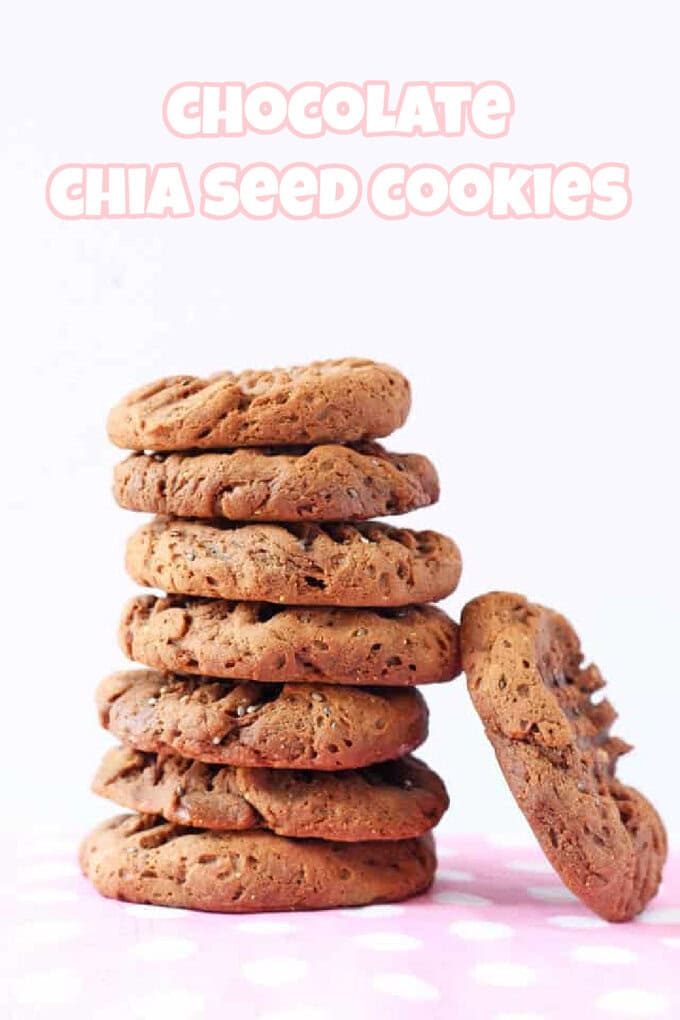 A stack of chocolate chia seed cookies balanced on a pink and white polka dot tablecloth.