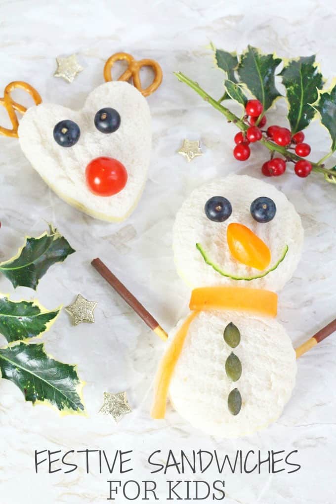 Sandwiches in the shape of a snowman and a reindeer topped with fruit and veg for features.