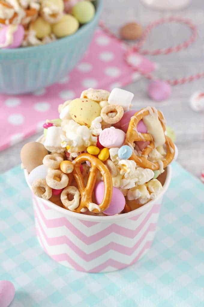 A close up of the Easter Trail Mix showing the popcorn, pretzels, cheerios, mini marshmallows, mini eggs and the sprinkles.