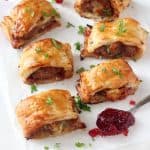 A delicious festive take on the classic sausage roll, made instead with turkey mince, cranberry sauce and brie. These mini pastry rolls will make a fantastic appetizer of party snack this Christmas!