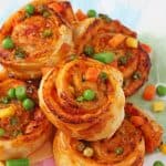 Super easy to make and packed with mixed vegetables, these Veggie Pizza Puff Pastry Roll Ups are sure to go down a treat with the whole family!