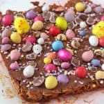 A delicious no-bake Easter delicious made with cornflakes, chocolate and peanut butter and topped with Mini Eggs and Smartie Eggs!