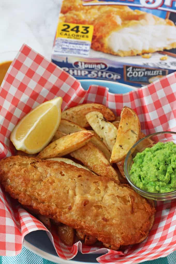 Chip Shop style fish and chips made easy with Young's Chip Shop Cod Fillets, homemade chips, minted mushy peas and curry sauce!