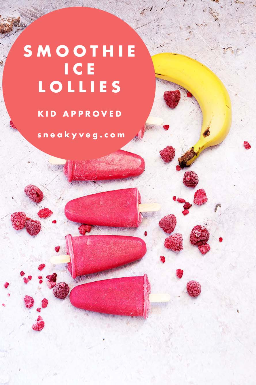 5 red smoothie ice lollies arranged on a concrete style background with frozen berries and a banana.