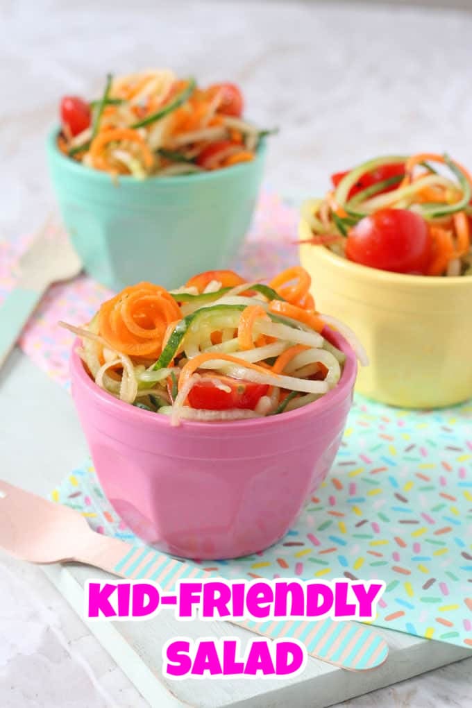 3 Spiralized salads served in small individual brightly coloured melamine pots.