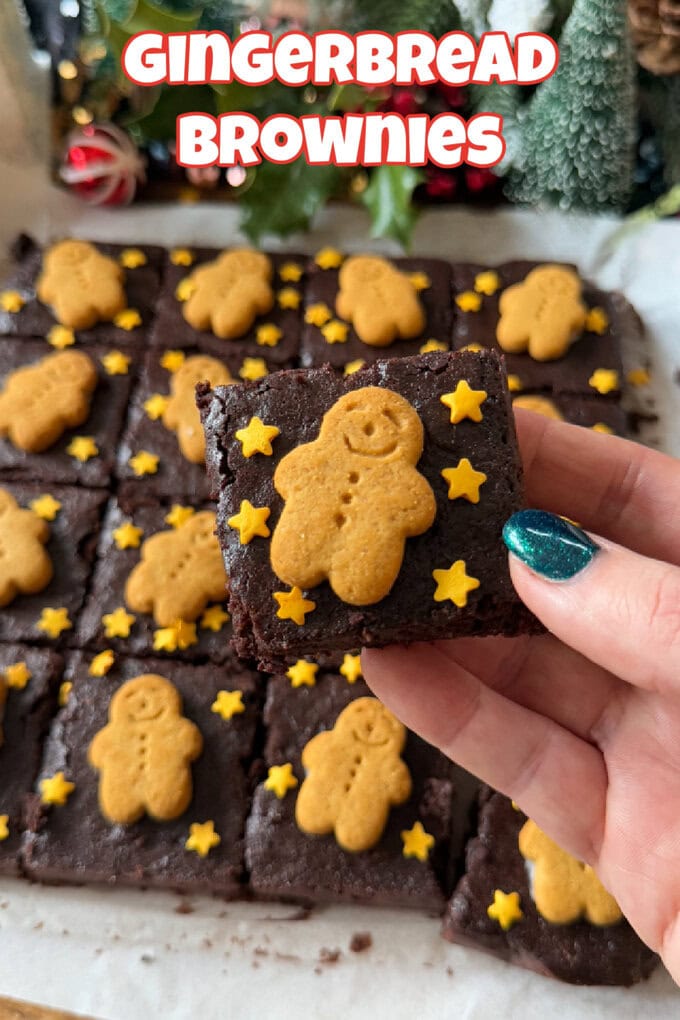A Tray of Gingerbread Brownies cut into 12 portions topped with gold stars and mini gingerbread men.