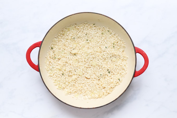 oil, chopped onion, garlic, thyme and risotto rice in an oven proof dish
