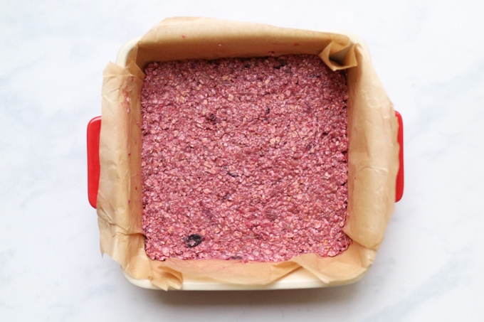 oat bar mixture in lined baking dish