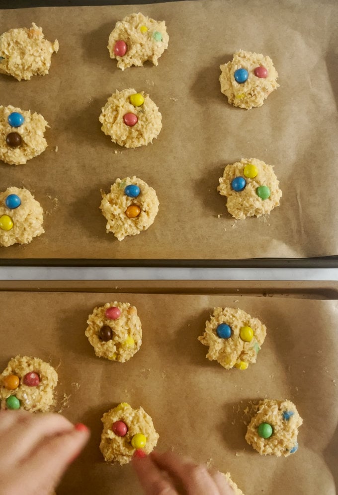 Cookies are placed onto a greased baking tray ready for the oven.