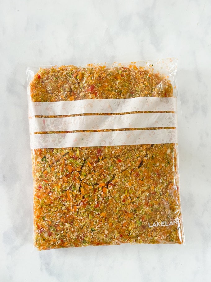 Vegetables all blitzed up and presented in a see-through freezer bag.
