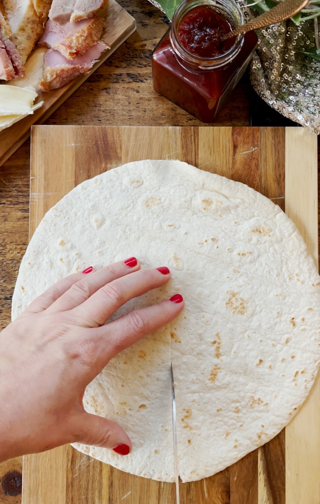 A cut being made in the wrap, so it can be folded once ingredients added.