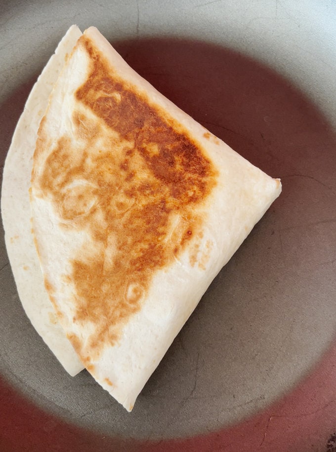The Christmas Leftovers Toasted Wrap in a frying pan.