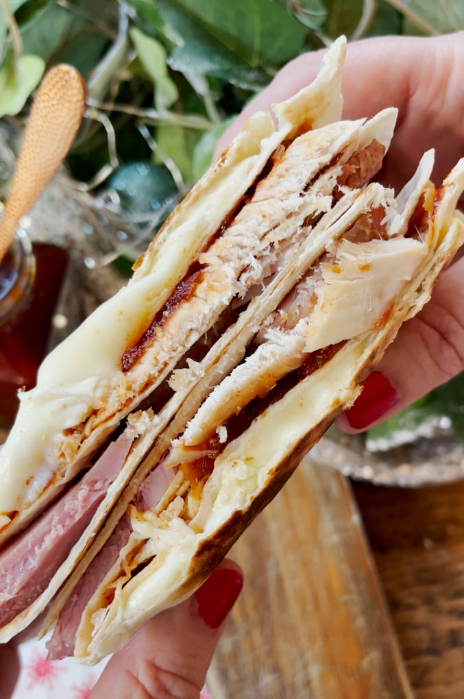 Photo of the Christmas Leftovers Toasted Wrap cooked and cut in half so you can see the cooked ingredients inside.