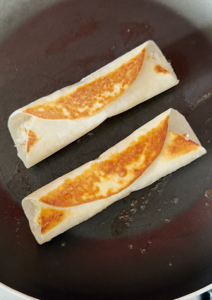 Wraps cooking in a small frying pan.