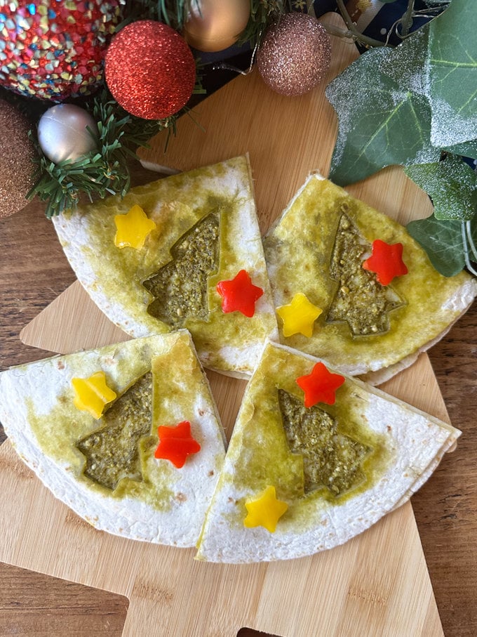 Christmas Quesadillas arranged on a festive back ground.