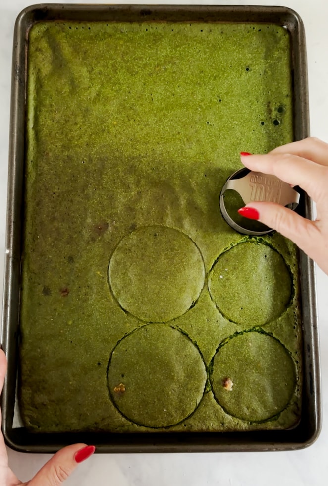 Circles being made in the cooked pancake mixture with a round pastry cutter.