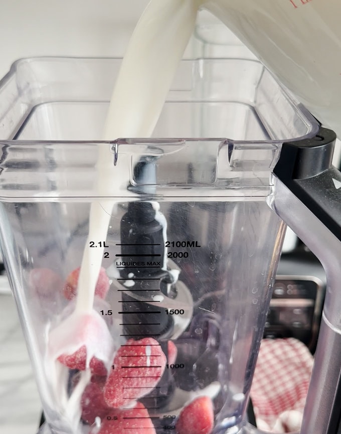 Ingredients being added to a food mixer.
