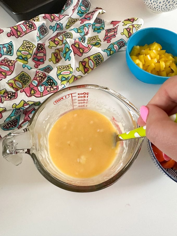 Ingredients being mixed in a glass Pyrex jug.
