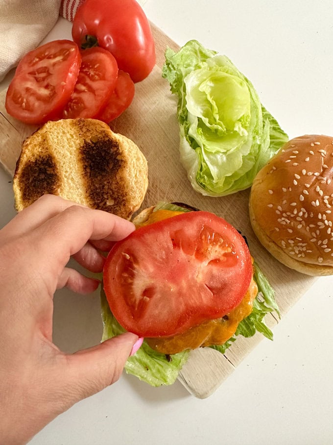 Smash burger being assembled.