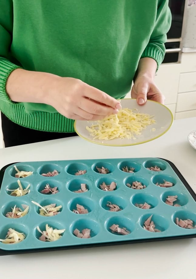 Ingredients for mini egg bites in a muffin tray.
