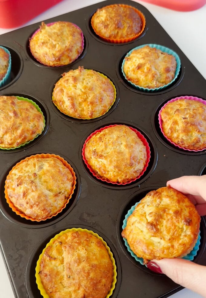 Chicken and cheese lunchbox muffins fresh out of the oven looking golden brown and delicious.