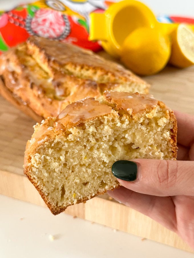 A slice of lemon loaf fresh out of the oven.