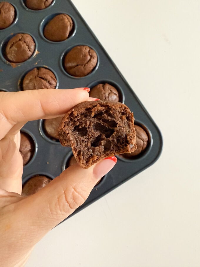 Close up photo of a mini choc chip muffin.