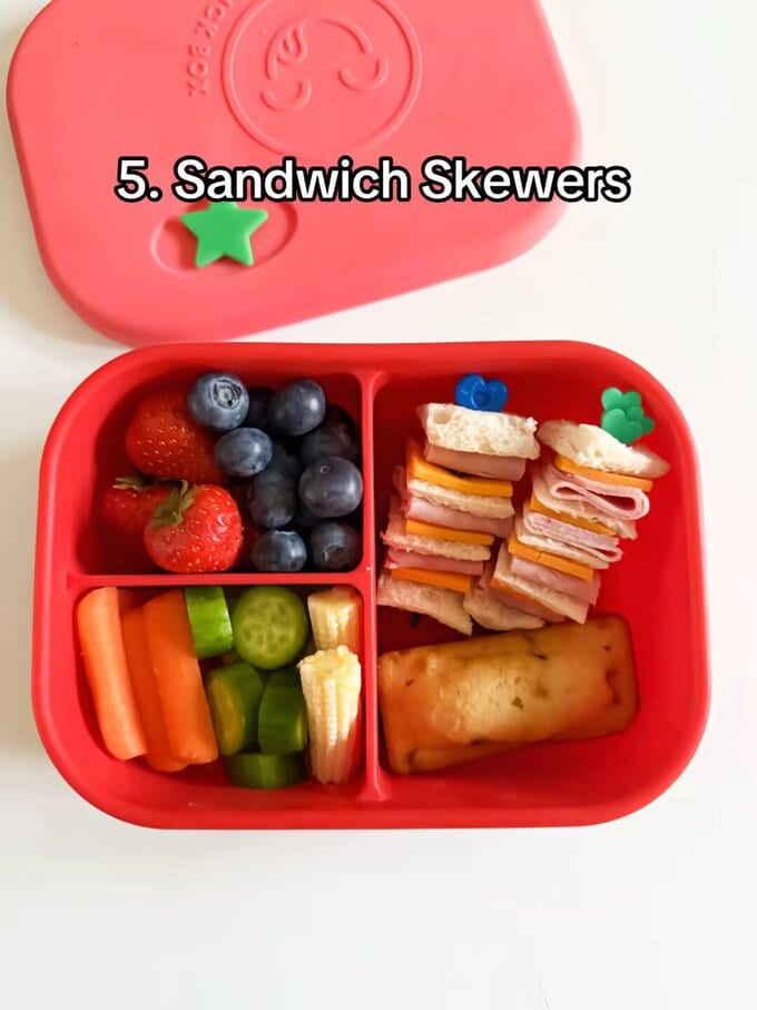Sandwich Skewers served on Pick sticks and all in  a bright red kids lunch box.