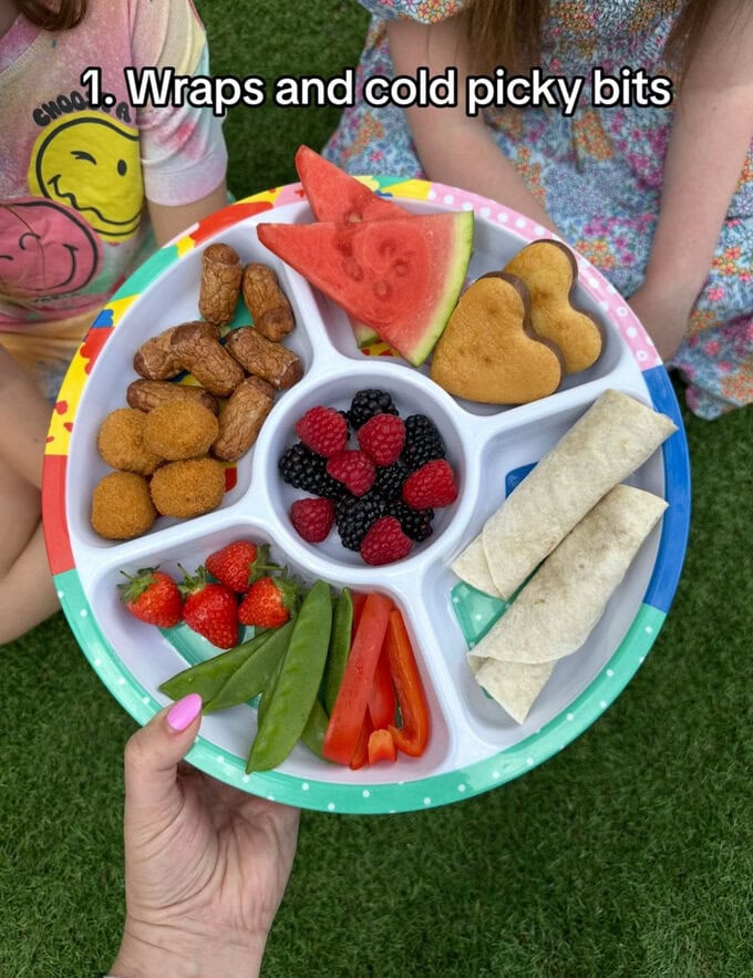Wraps and cold picky bits served in a large biggie pick plate.