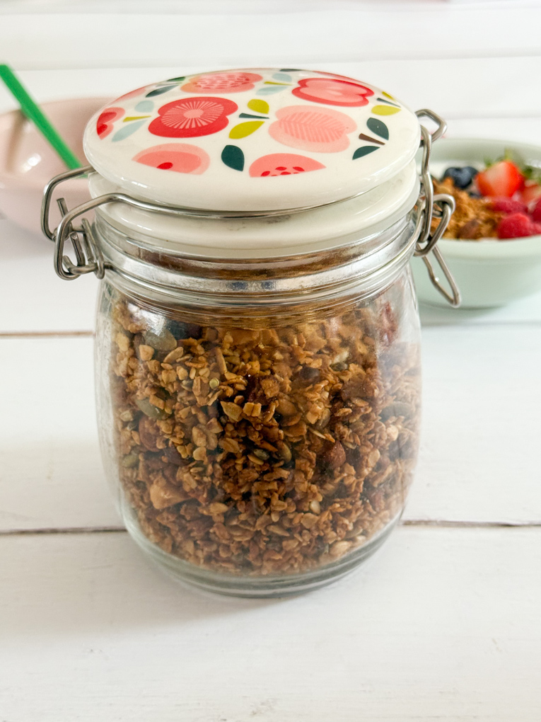 A sealed glass jar filled with homemade Airfryer granola.